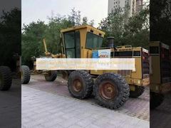 Używana spycharka Caterpillar 160h, wyprodukowana w Japonii, z ładowaczem czołowym i napędem typu Skid Steer